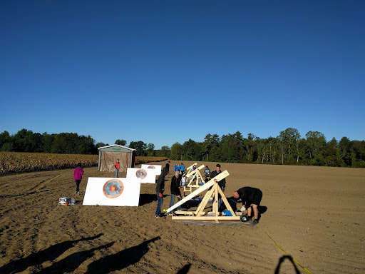 targets and trebuchet in field 